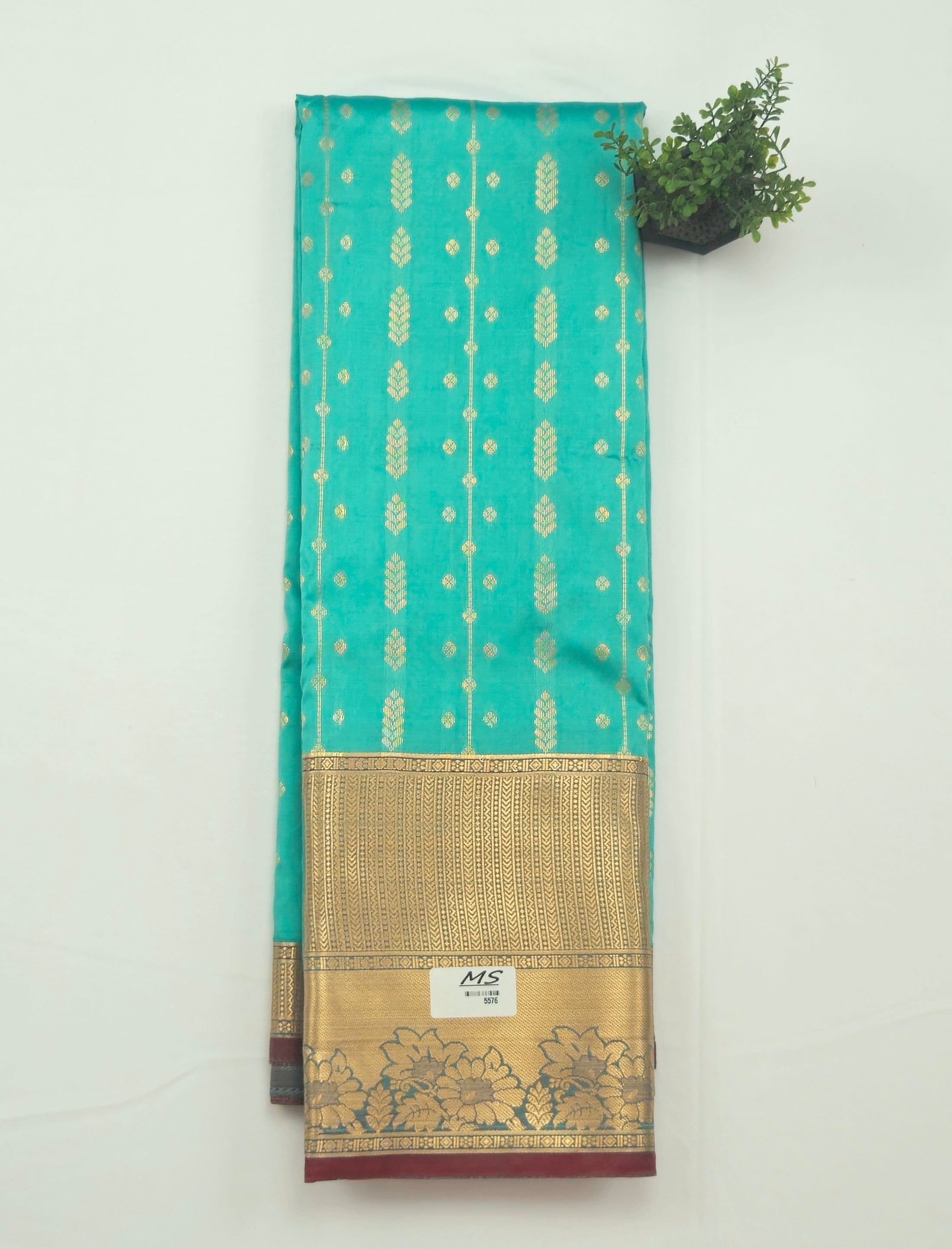 Kanchivaram golden line weaves saree in Blue-green color with geometric weaves