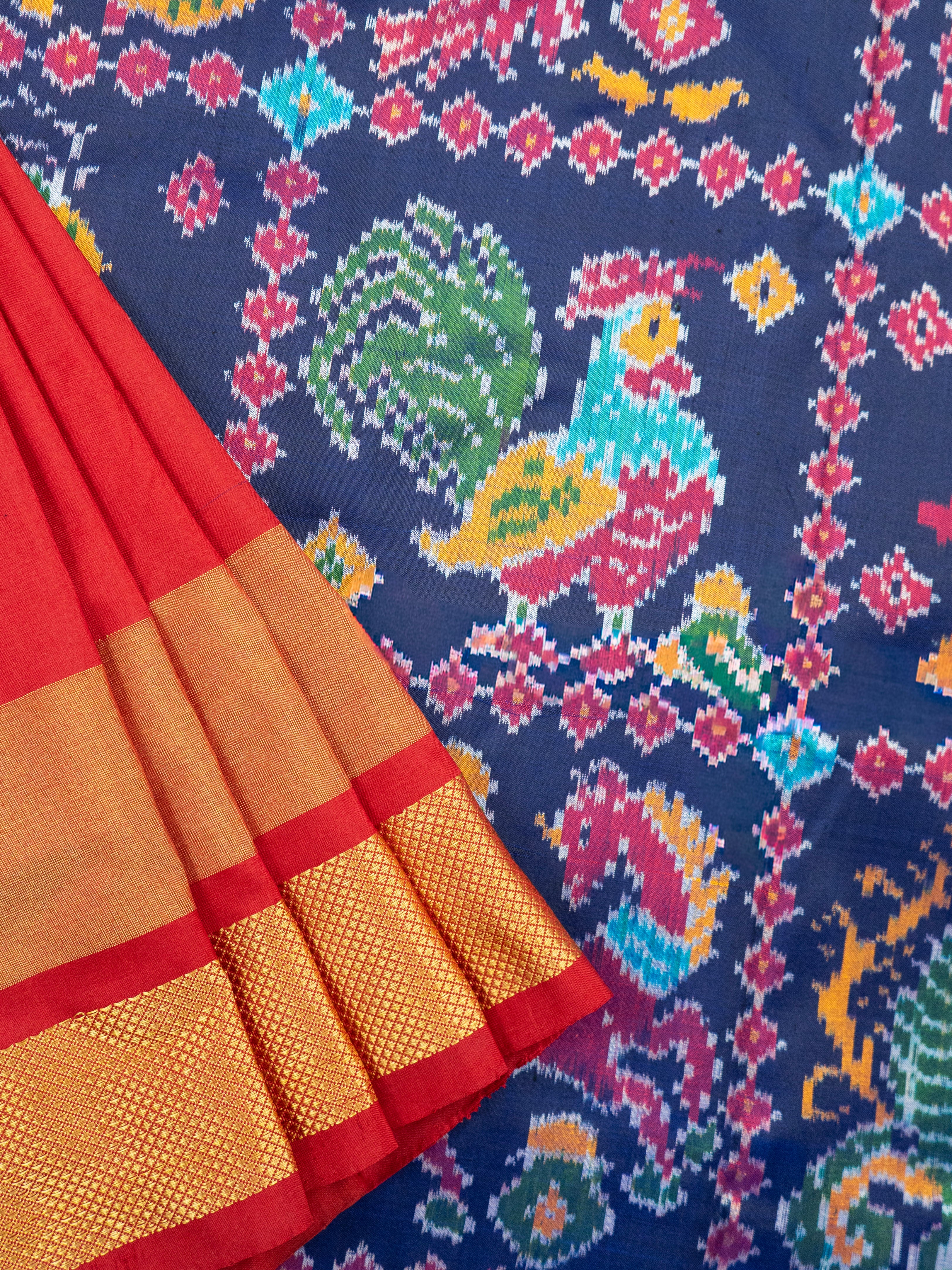 Pure Pochampally Double Ikat Silk Saree in Blue with Multicolor Ikat & Red Animal Pallu