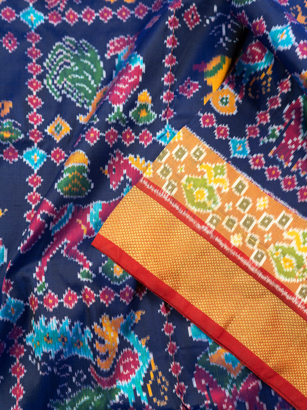 Pure Pochampally Double Ikat Silk Saree in Blue with Multicolor Ikat & Red Animal Pallu