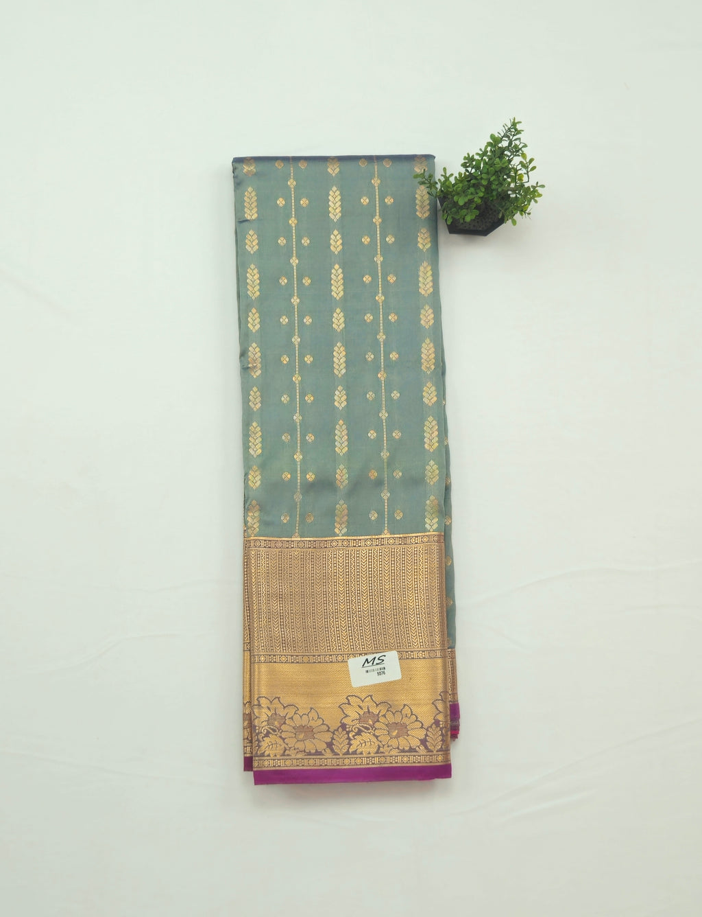 Kanchivaram golden line weaves saree in grey color with geometric weaves