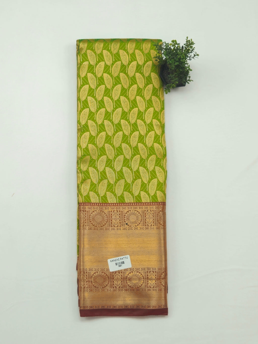 Kanchivaram golden leaf weave saree in lime green color with pattu border