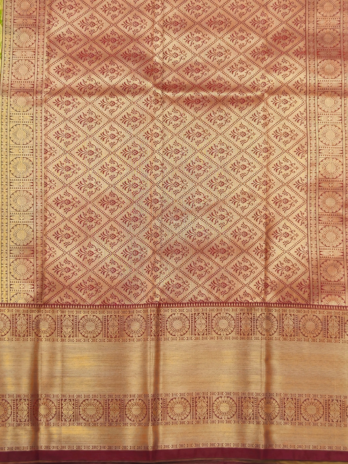 Kanchivaram golden leaf weave saree in lime green color with pattu border