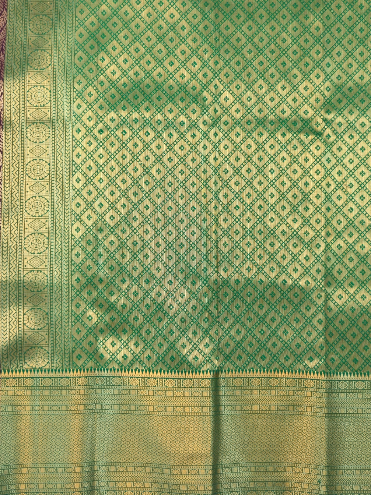 Kanchivaram golden line weaves saree in deep brown color with geometric weaves