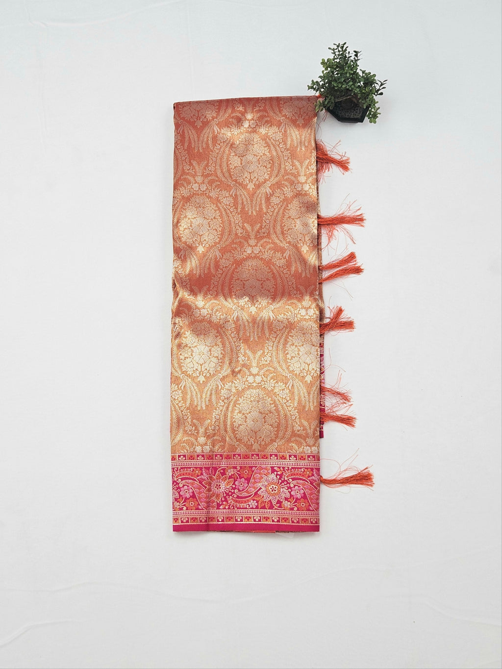 Kanchivaram heavy weaves saree in orange color with contrast weaved pink blouse