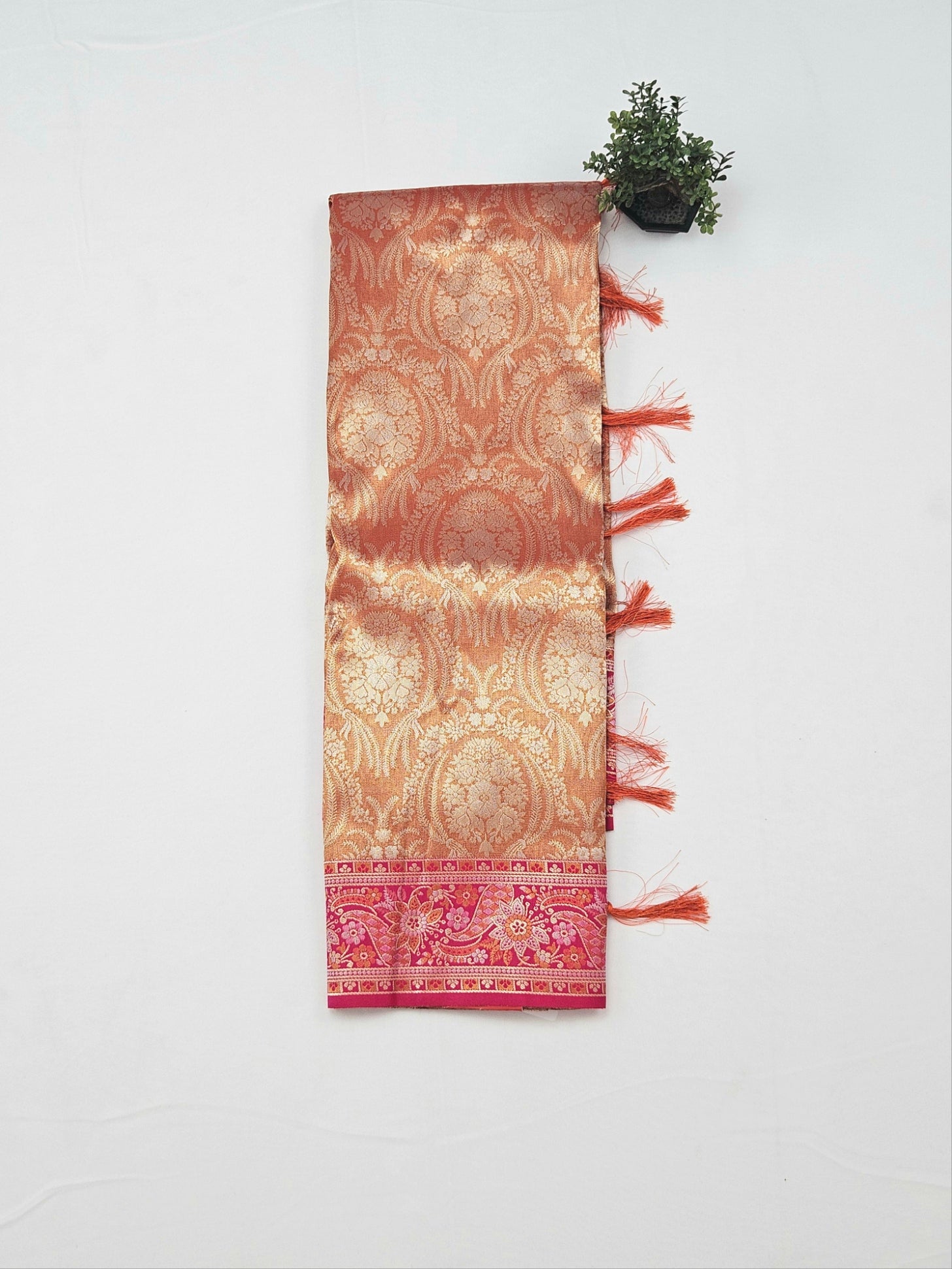 Kanchivaram heavy weaves saree in orange color with contrast weaved pink blouse