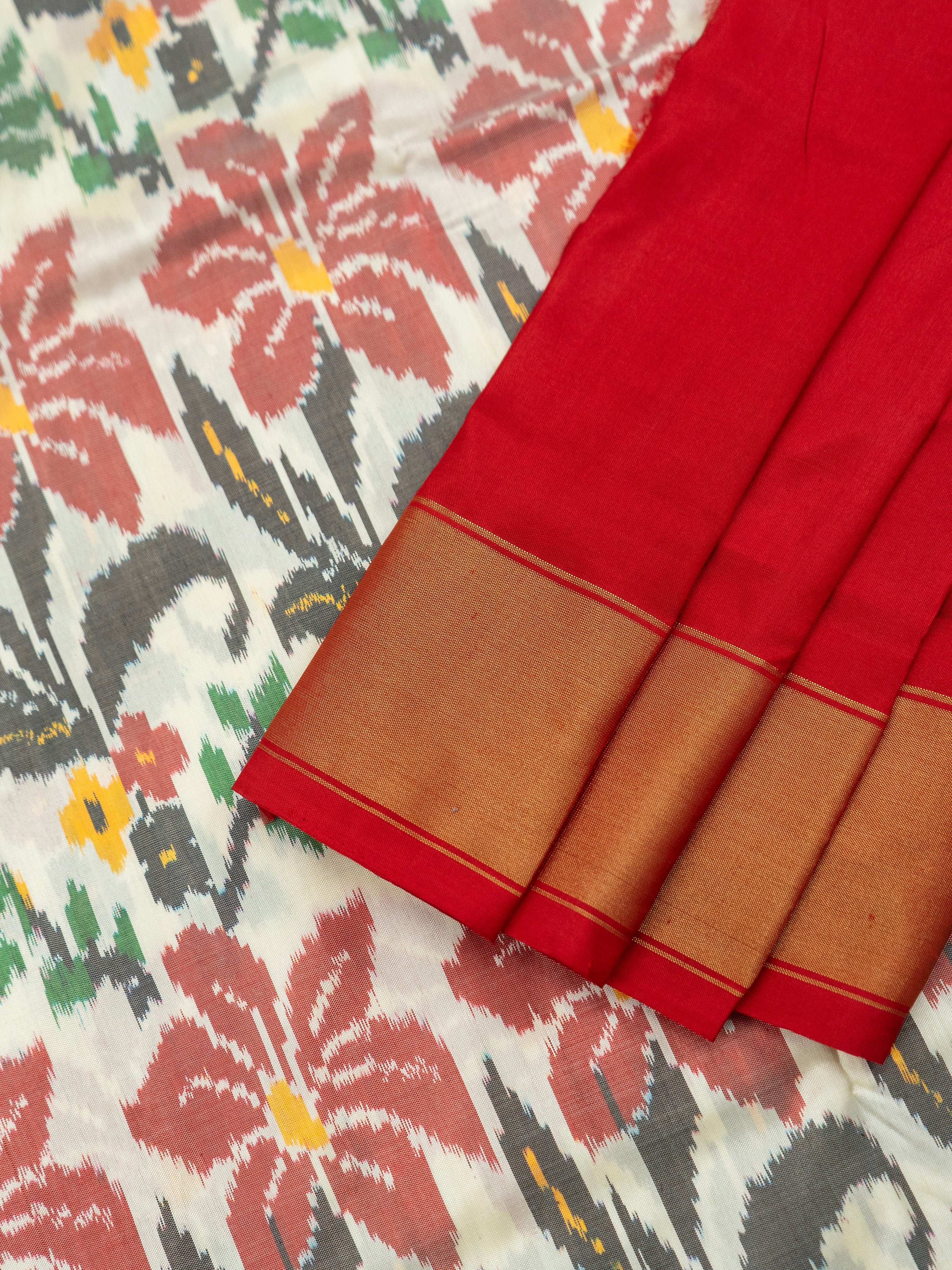 Pure Pochampally Double Ikat Silk Saree in White with Red Ikat Floral Pallu