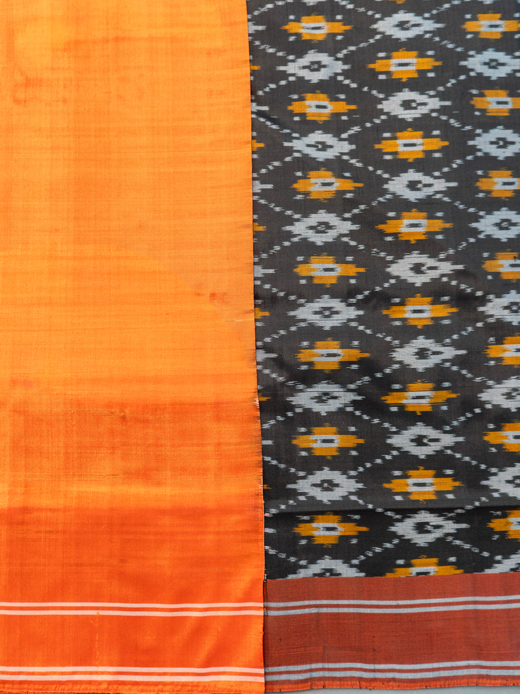 Pure Pochampally Silk Saree in Black with Orange Ikat Pallu & Border