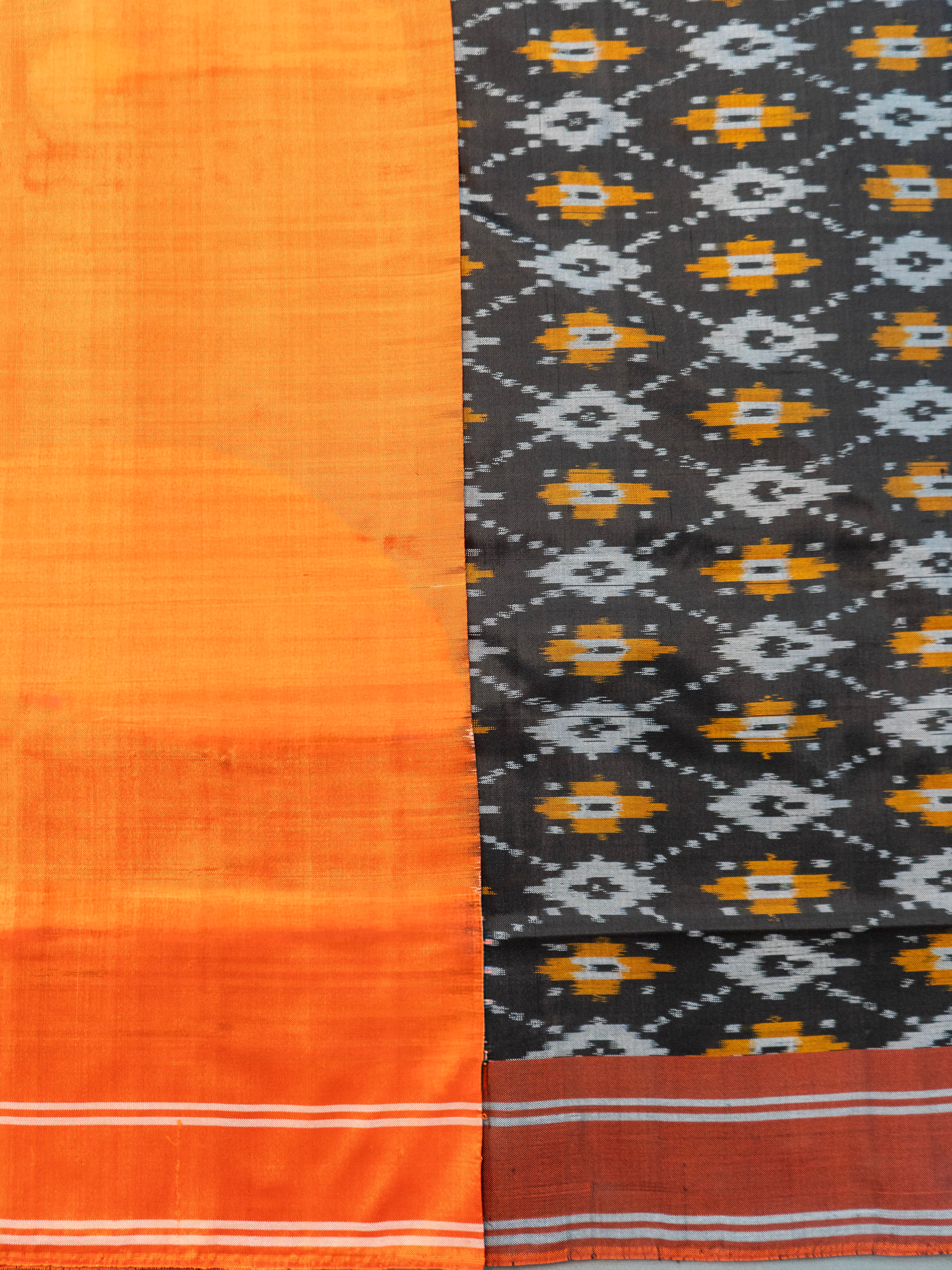 Pure Pochampally Silk Saree in Black with Orange Ikat Pallu & Border