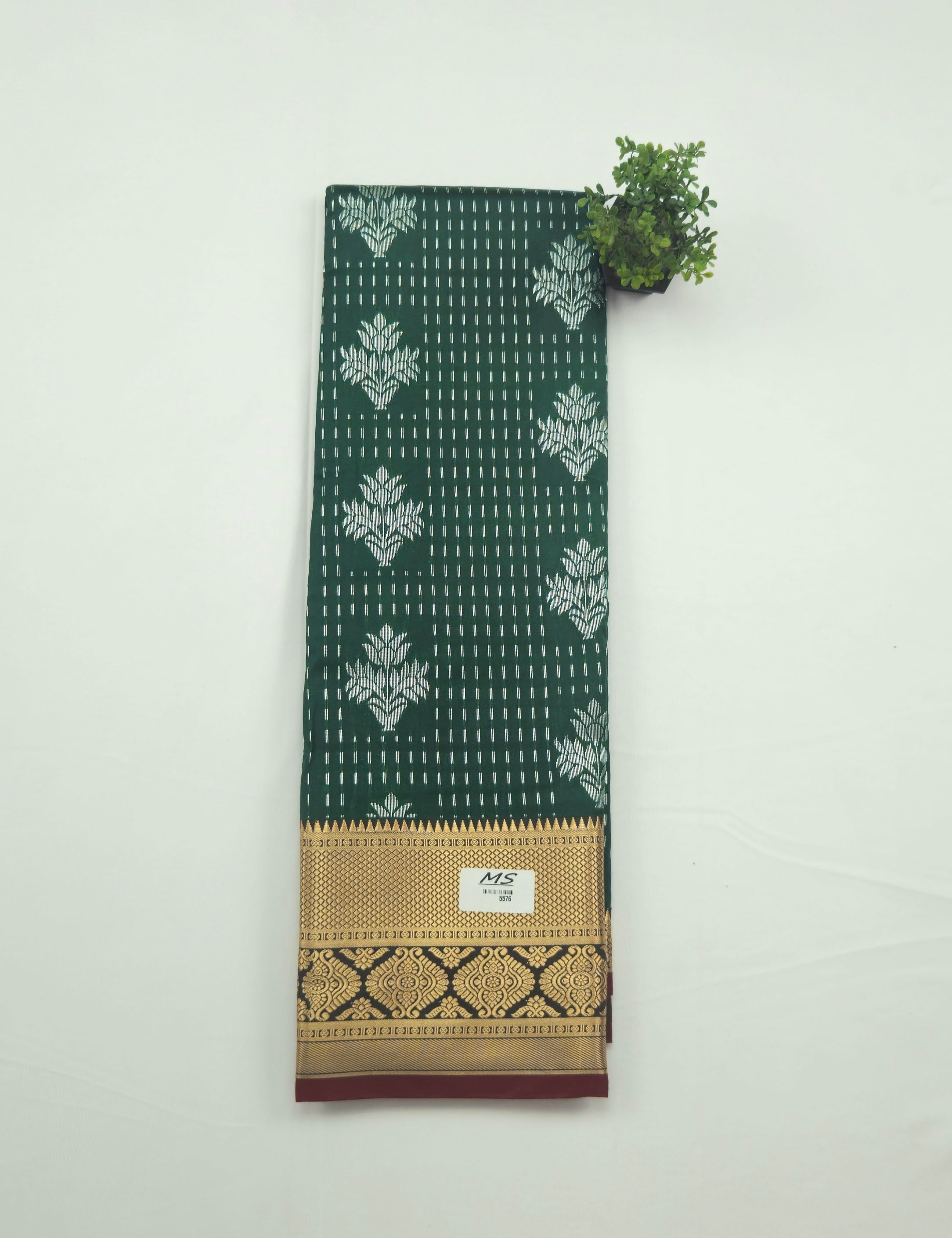 Kanchivaram silver weaving saree with gold pattu border in dark greencolor with contrast blouse
