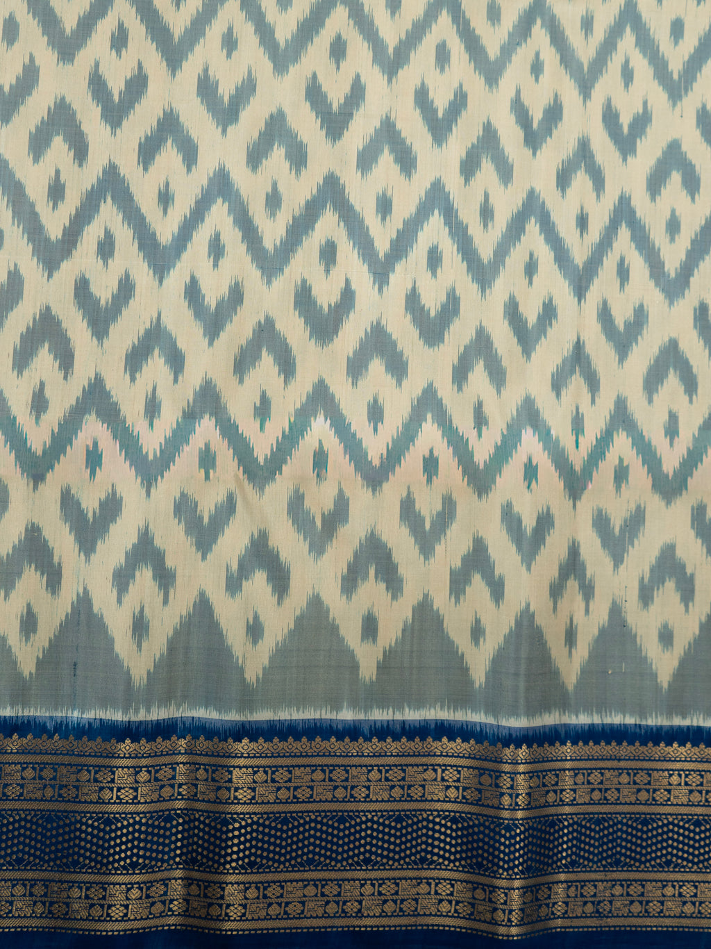 Pure Pochampally Double Ikat Silk Saree in White with Blue Ikat Pallu & Gold Zari Border