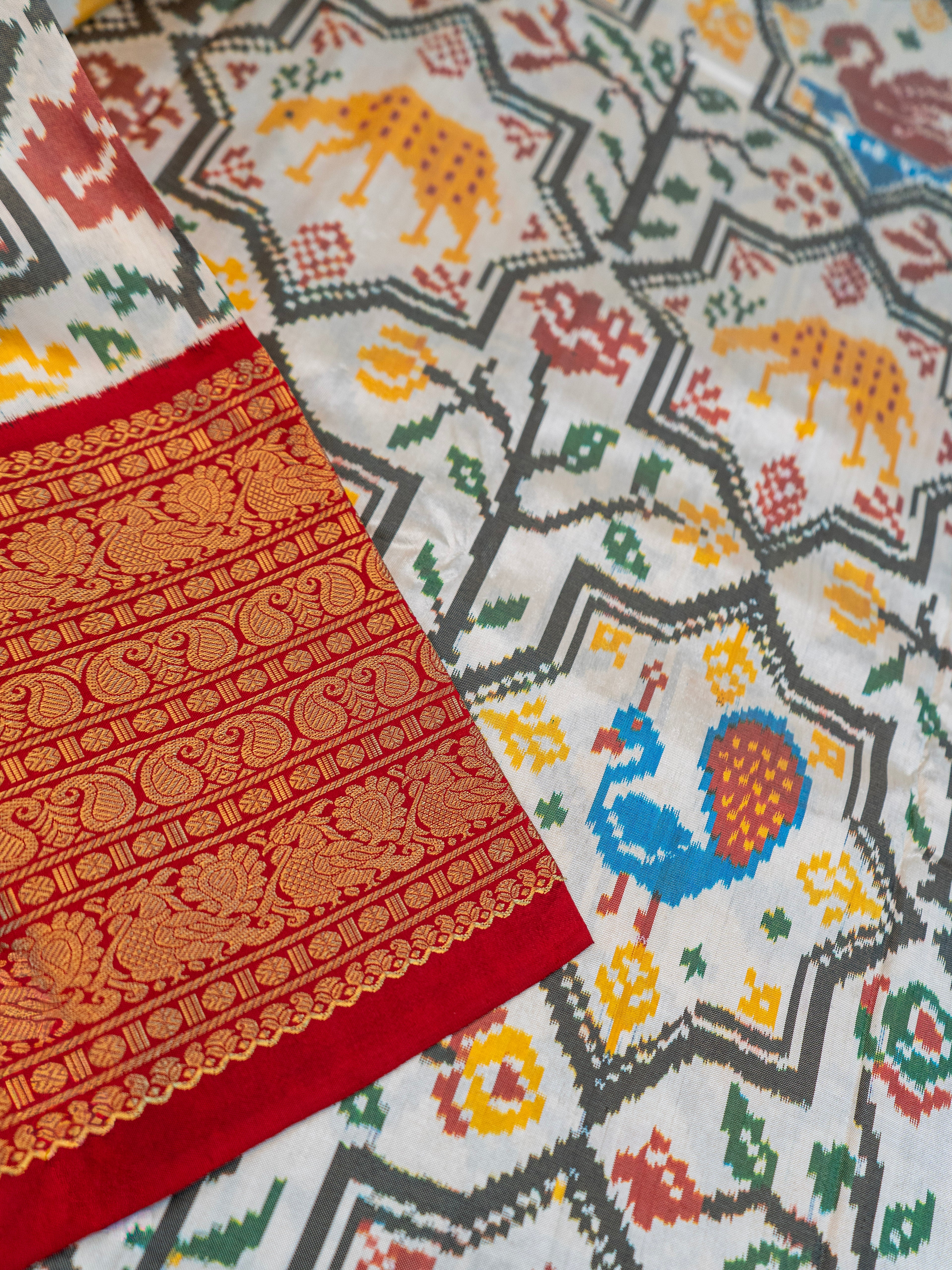 Signature Kanchipuram Pochampally Double Ikat Silk Saree in White with Red Zari Pallu