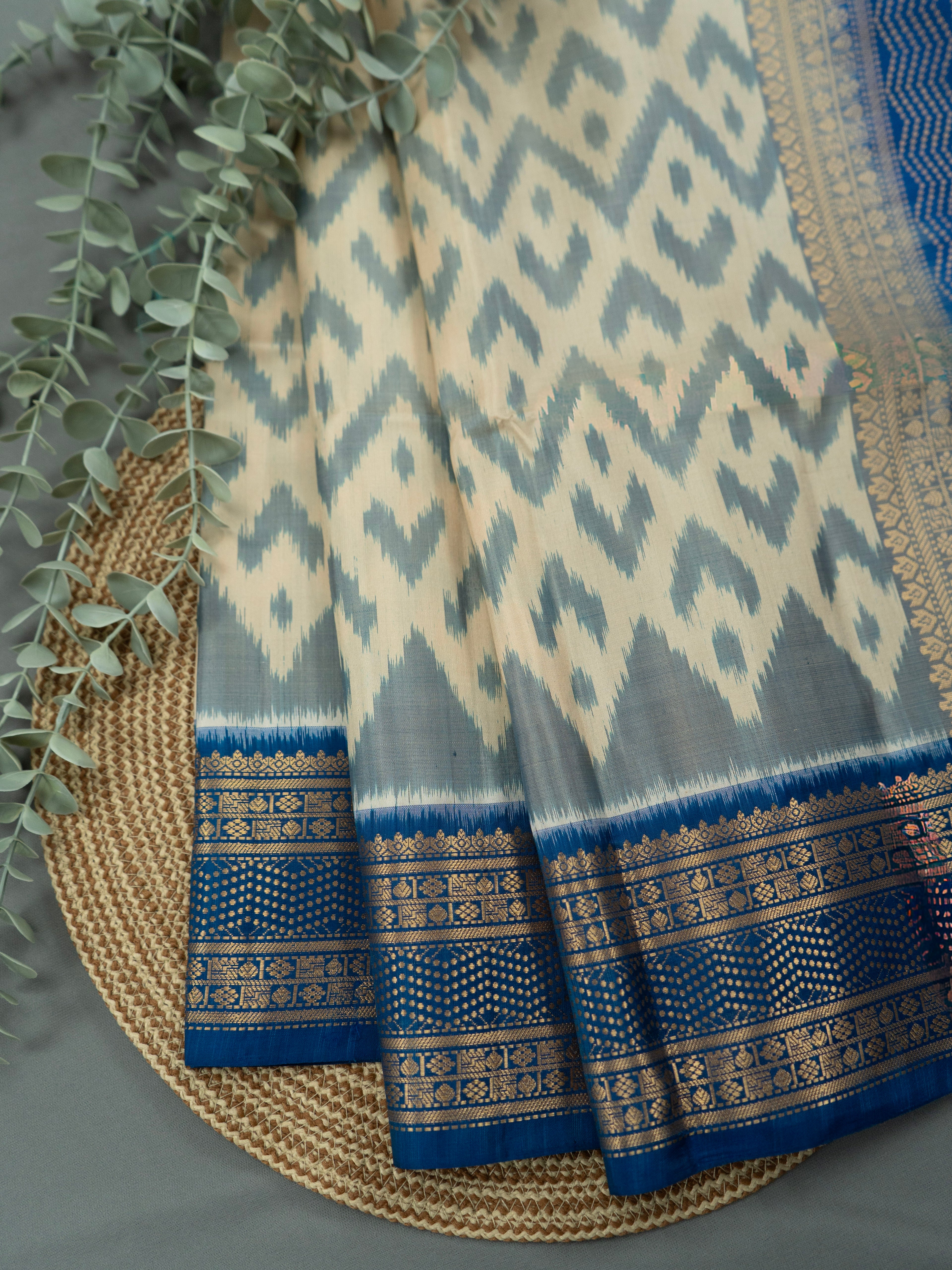 Pure Pochampally Double Ikat Silk Saree in White with Blue Ikat Pallu & Gold Zari Border