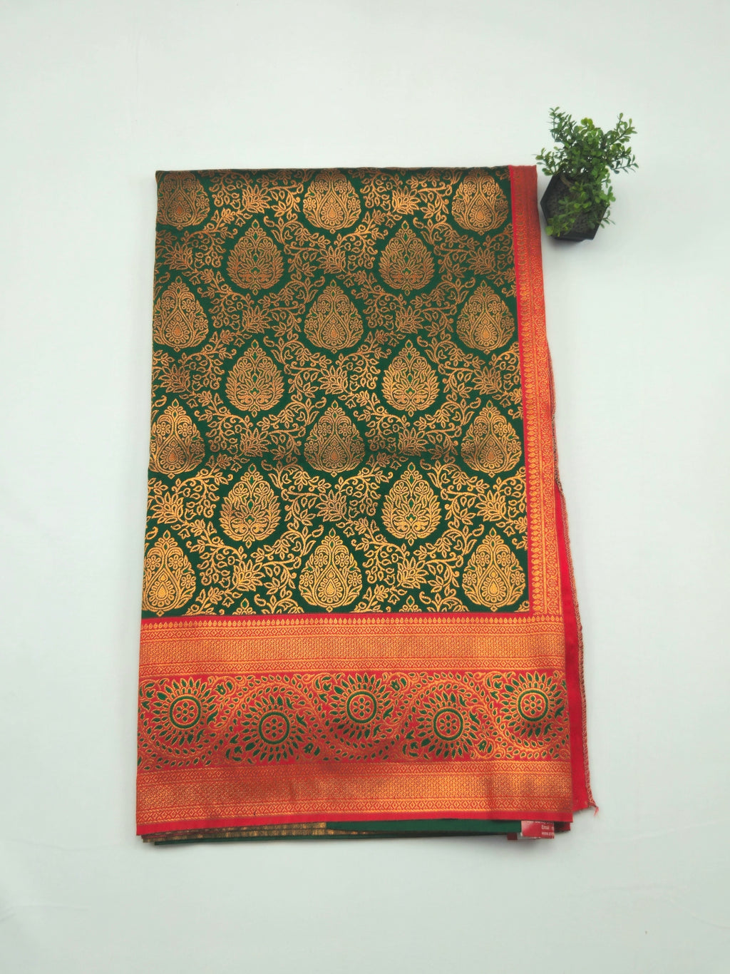 Kanchivaram gold brocrade weaving saree in dark green color with contrast plain blouse