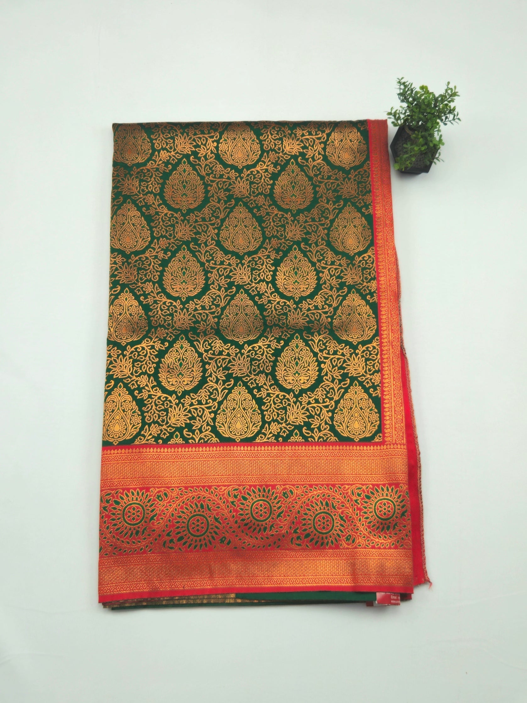 Kanchivaram gold brocrade weaving saree in dark green color with contrast plain blouse