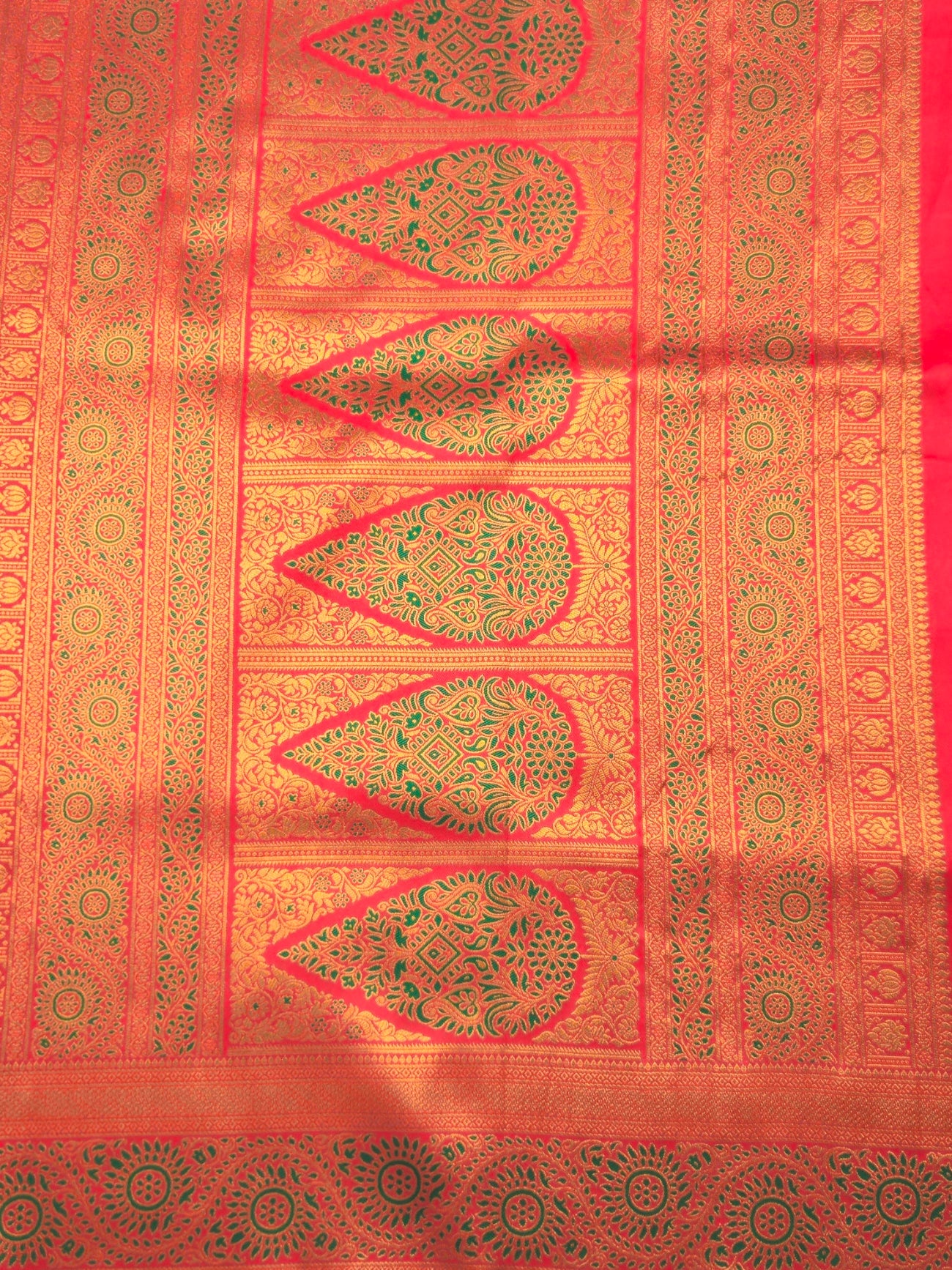 Kanchivaram gold brocrade weaving saree in dark green color with contrast plain blouse