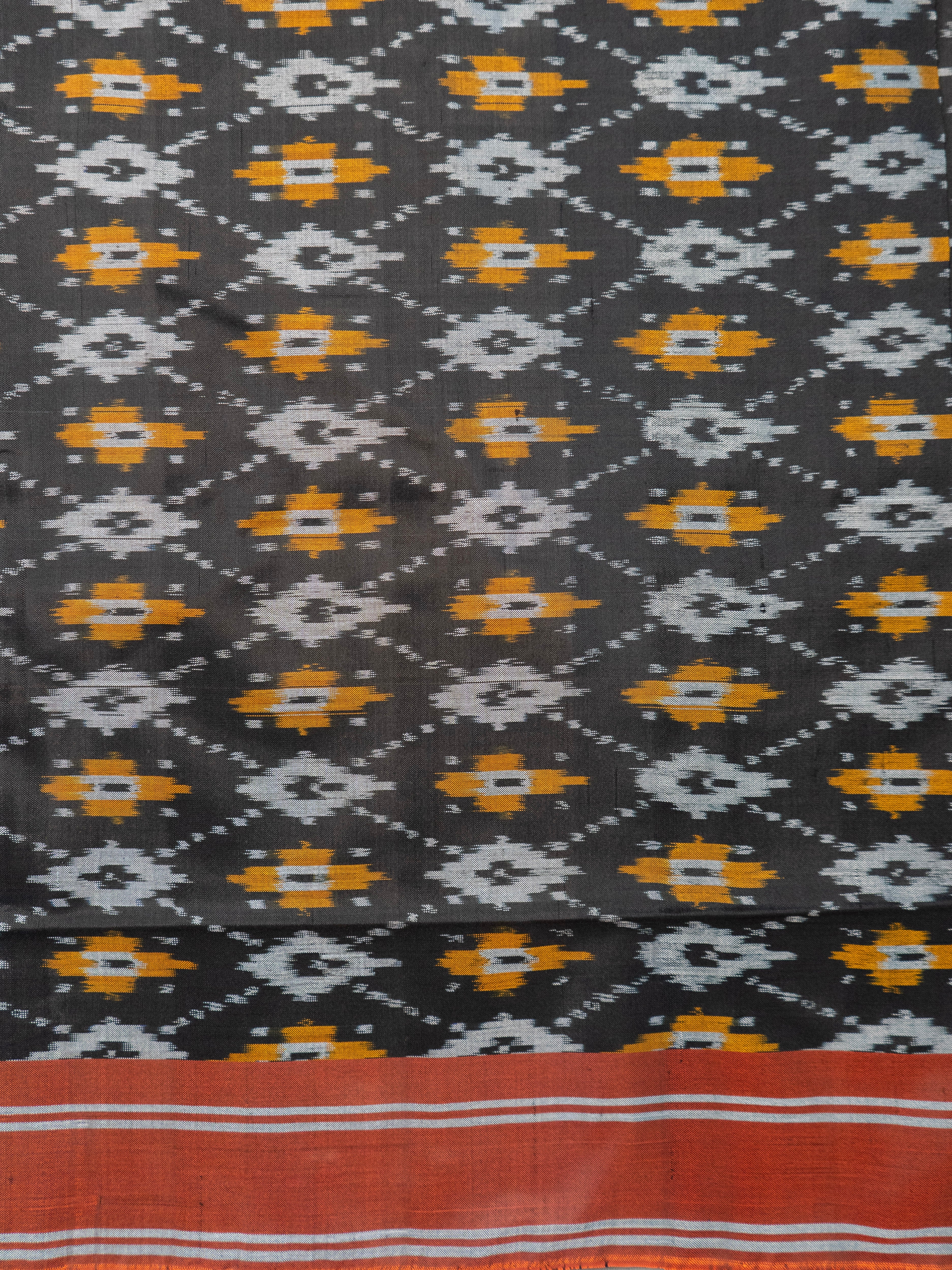 Pure Pochampally Silk Saree in Black with Orange Ikat Pallu & Border