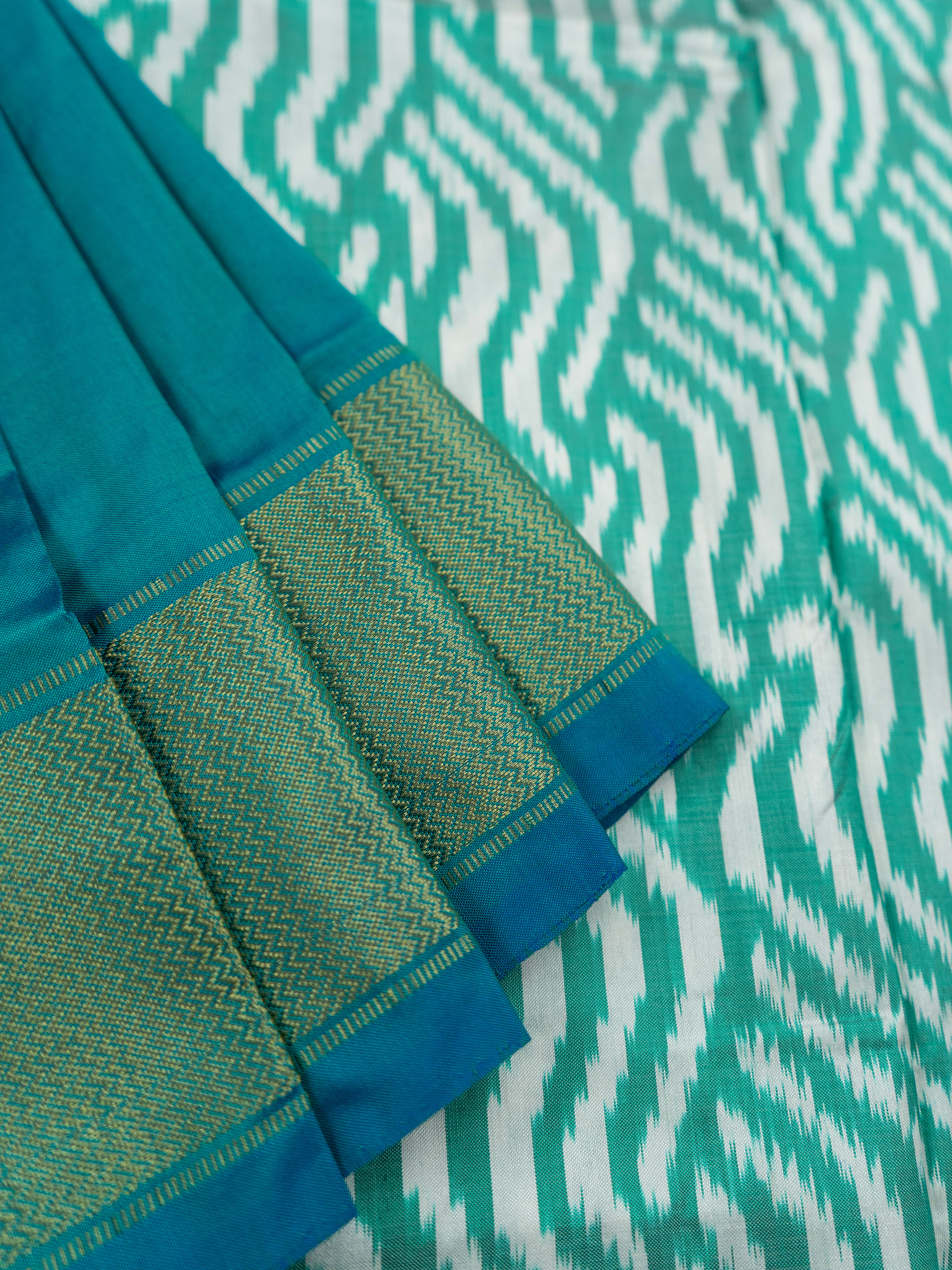Pure Pochampally Double Ikat Silk Saree in Sea Green & White with Zari Pallu