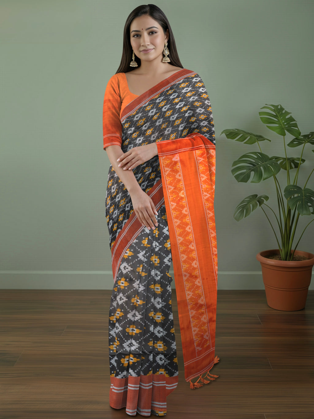 Pure Pochampally Silk Saree in Black with Orange Ikat Pallu & Border