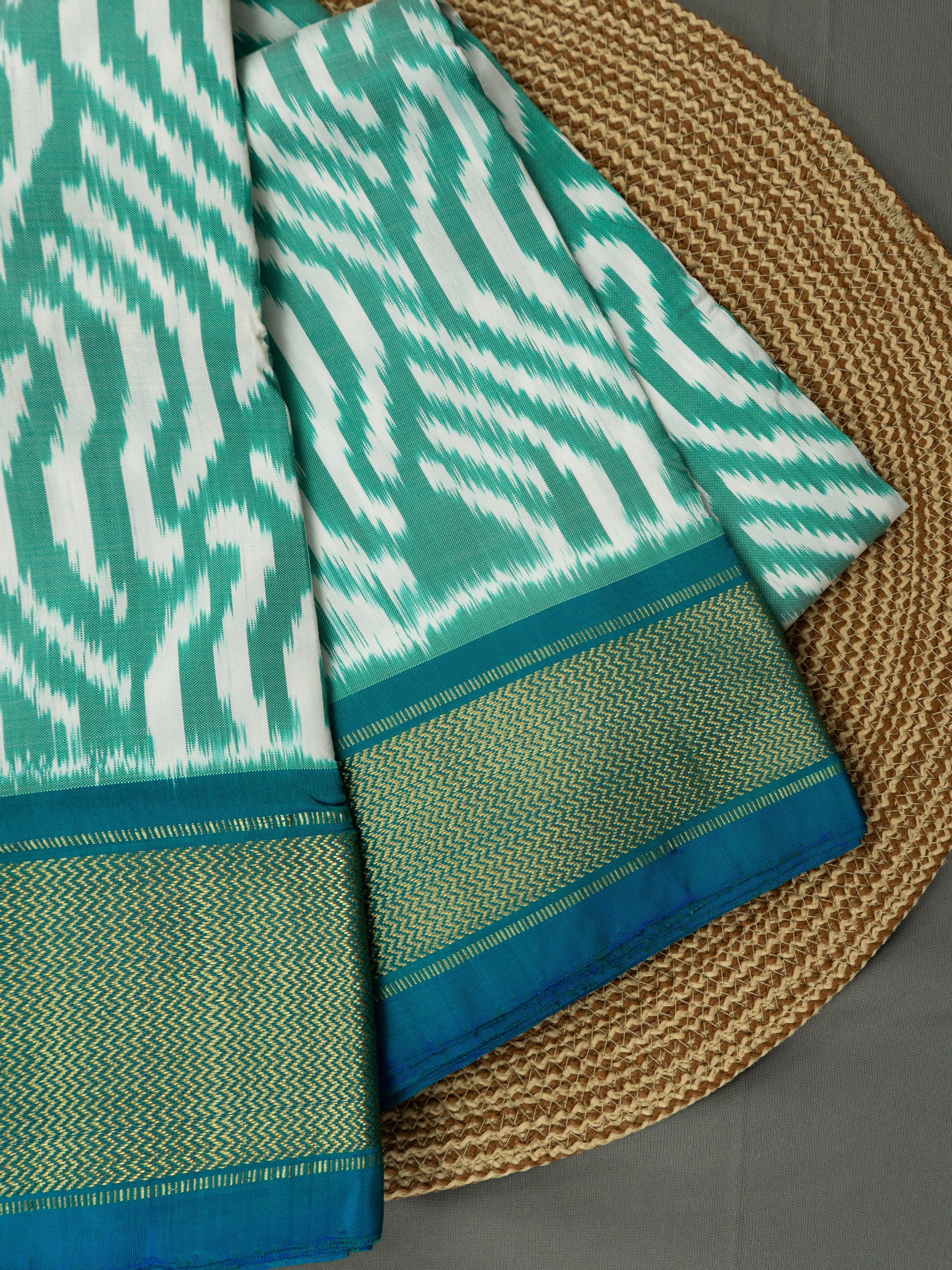 Pure Pochampally Double Ikat Silk Saree in Sea Green & White with Zari Pallu