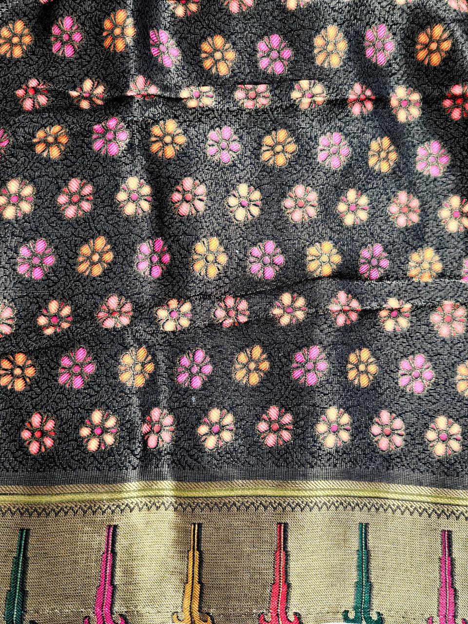 Kanchivaram floral work saree in black base with pallu and floral blouse
